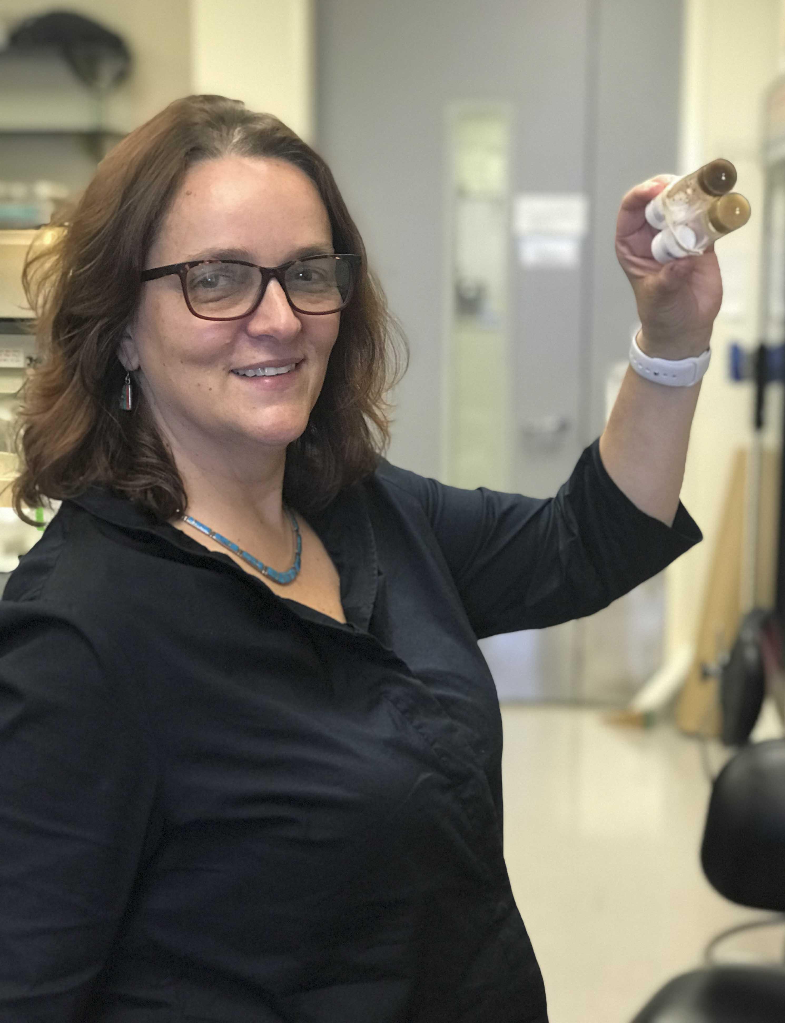 Dr. Daniela Zarnescu with model organism of fruit flies